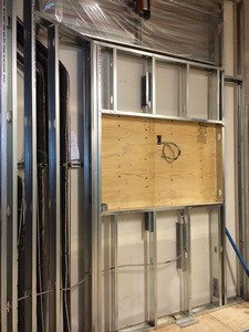 Entry wall framed for signage.